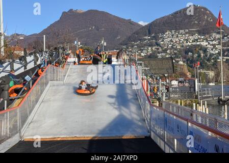 Lugano, Switzerland - 10 July 2016 - children who practice ice tubing at Lugano on Switzerland Stock Photo