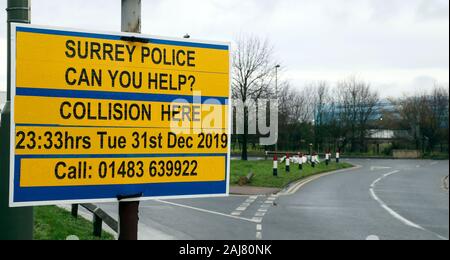 A police sign appealing for witnesses at the scene in Stanwell, near London's Heathrow Airport, of a fatal crash on New Year's Eve in which three British Airways cabin crew died. Stock Photo