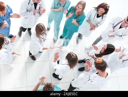 male doctor standing in front of a group of medical students. Stock Photo