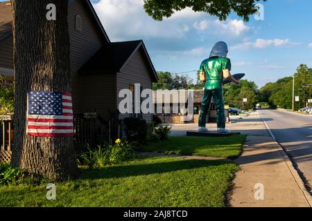 Wilmington, Illinois, USA - July 5, 2014: A stretch of the historic route 66 in the city of Wilmington, wih an American Flag and the Gemini Giant stat Stock Photo