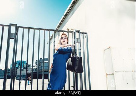 Stylish lady in blue dress Stock Photo