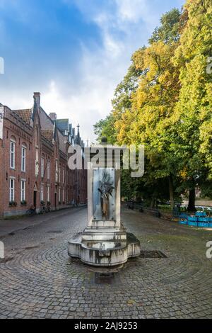Horse Head Drinking Fountain is a fountain and watering place for horses in the old flemish city of bruges Stock Photo