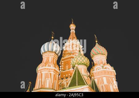 Close up of colorful domes of Basil's cathedral in Moscow at dark night. Beautiful patterned domes of Pokrovsky Cathedral, church and museum, Russian Stock Photo