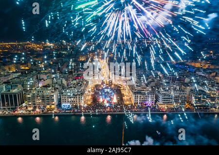 Aerial view of Aristotelous square in Thessaloniki in northern Greece during New Year 2020 celebrations with fantastic multi-colored fireworks Stock Photo