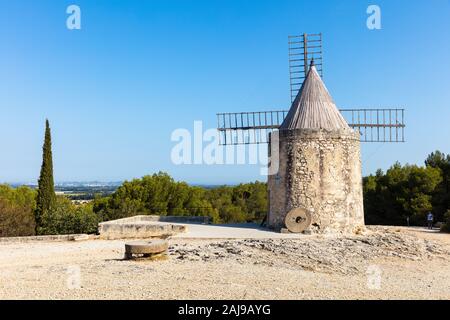 a view of the Moulin de Daudet in Fontvieille / Provence (France). This windmill was the former home of famous French writer Alphonse Daudet. Stock Photo