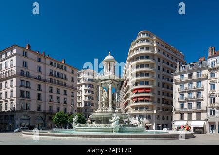 Lyon, France - July 18, 2018: Tourists visiting the jacobins square in the vieux lyon district and the beautiful fountain in the center. Stock Photo