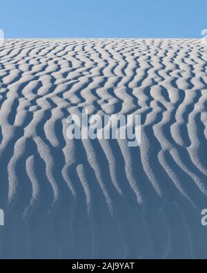 Ripples in the white sand against clear sky at White Sands National Park in New Mexico Stock Photo