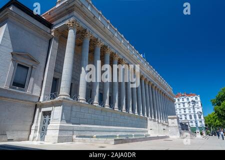 Lyon, France - July 19, 2018: Tourists in front of the courthouse of Lyon. Corinthian style columns decorate the main entrance. Stock Photo