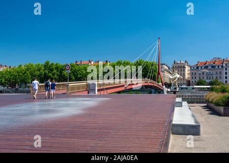 Lyon, France - July 19, 2018: Tourists on Gateway Courthouse, a bridge with a single pylon and cables. Stock Photo