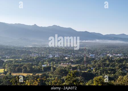 View of the small town which located in the plains between the mountains, northern of Thailand. Stock Photo