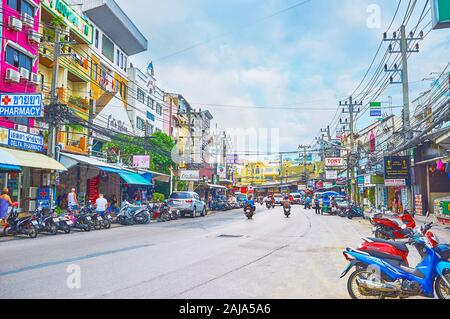 PATONG, THAILAND - APRIL 30, 2019: The modern housing of resort with numerous cafes, shops, drug stores and other tourist facilities, on April 30 in P Stock Photo