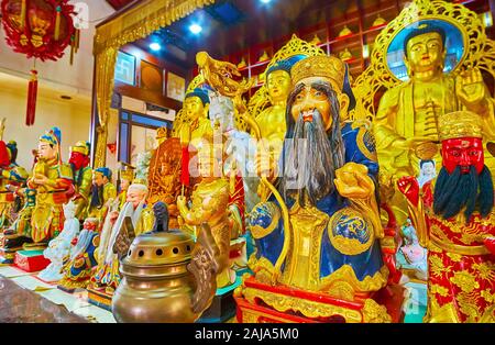 PHUKET, THAILAND - APRIL 30, 2019: The sculptures of Chinese Gods and Buddha Images on the altar of Sam Sae Chu Hut Chinese Shrine, on April 30 in Phu Stock Photo