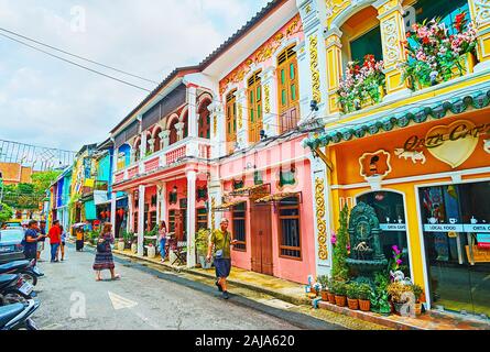 PHUKET, THAILAND - APRIL 30, 2019: Preserved Sino-Portuguese townhouses are the visit card of Phuket City, here situated many tourist stores, cafes an Stock Photo