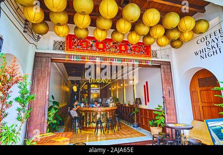 PHUKET, THAILAND - APRIL 30, 2019: The canopy of Thalang Bar is decorated with many Chinese Lanterns and its interior is designed in classic style, on Stock Photo