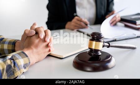 lawyer having meeting and consoling solution to his clients provide legal advice and trust commitment strain serious for problem, justice and attorney Stock Photo