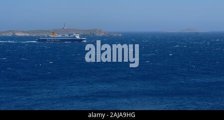 A blue Star ferry sailing into Syros, Greece. Stock Photo