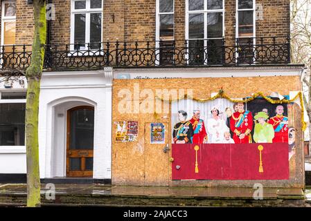 Painted art attached to empty building hoarding in Southend on Sea, Essex, UK, depicting the British Royal Family on balcony of Buckingham Palace Stock Photo