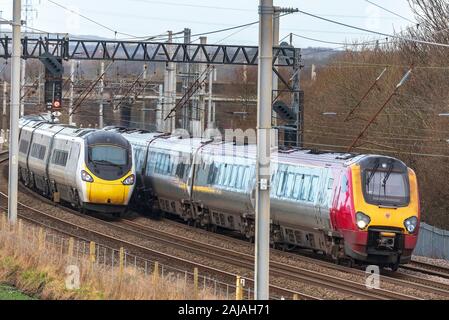 Avanti Pendolino class 900 iand Voyager train on the West Coast Main Line. Stock Photo