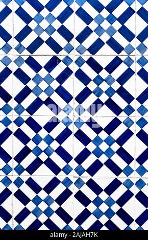 Portuguese traditional tiles Azulejos with blue geometrical pattern on a white background. Stock Photo