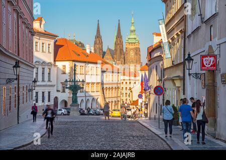 PRAGUE, CZECH REPUBLIC - OCTOBER 12, 2018: The St. Vitus cathedral and the Loretánská street in evening. Stock Photo