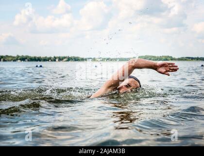 Young Girl Swimming in a Lake