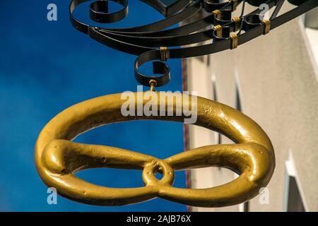 golden pretzel in big before blue sky Stock Photo