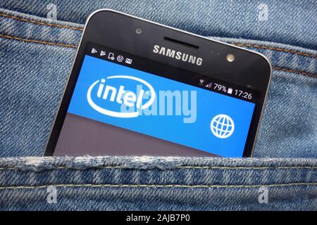 Intel website displayed on Samsung smartphone hidden in jeans pocket Stock Photo