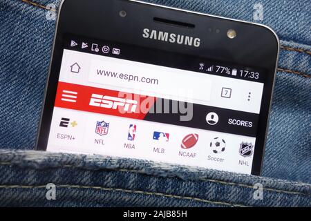 ESPN website displayed on Samsung smartphone hidden in jeans pocket Stock Photo