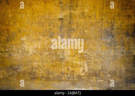 Real wall background, grungy yellow texture. Stock Photo