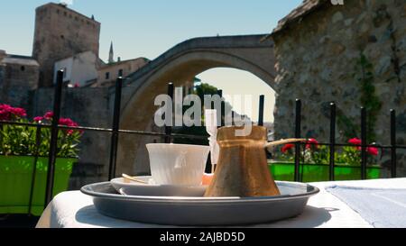 Coffee on the table with the view of Old bridge in the background - Mostar, Bosnia.