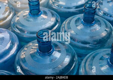 empty plastic canister bottles for water dispenser Stock Photo