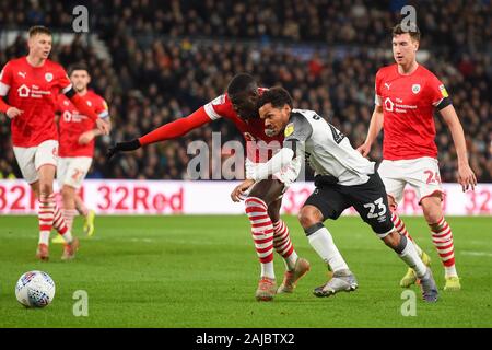 DERBY, ENGLAND - JANUARY 2ND Duane Holmes (23) of Derby County battles with Bambo Diaby (5) of Barnsley during the Sky Bet Championship match between Derby County and Barnsley at the Pride Park, Derby on Thursday 2nd January 2020. (Credit: Jon Hobley | MI News) Photograph may only be used for newspaper and/or magazine editorial purposes, license required for commercial use Credit: MI News & Sport /Alamy Live News Stock Photo