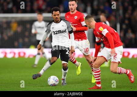 DERBY, ENGLAND - JANUARY 2ND Duane Holmes (23) of Derby County battles with Jordan Williams (2) of Barnsley during the Sky Bet Championship match between Derby County and Barnsley at the Pride Park, Derby on Thursday 2nd January 2020. (Credit: Jon Hobley | MI News) Photograph may only be used for newspaper and/or magazine editorial purposes, license required for commercial use Credit: MI News & Sport /Alamy Live News Stock Photo