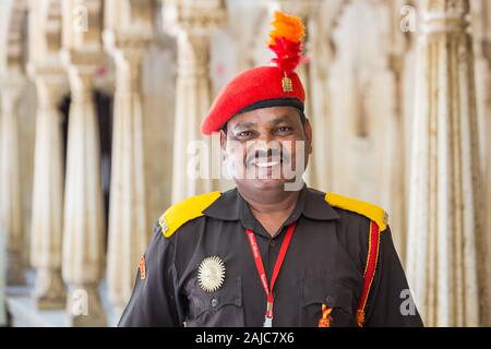 Udaipur, India - March 04 2017: A smiling man working at the City Palace Museum. A man is glad to all visitors. Stock Photo
