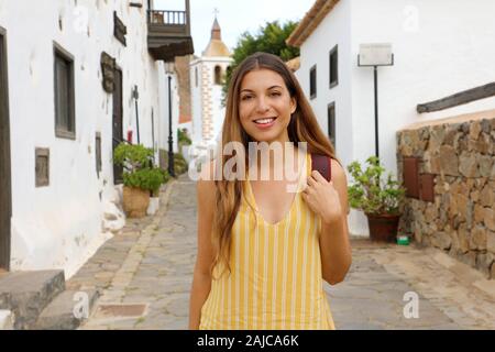 Pretty young traveler girl visits small town of Betancuria, Canary Islands, Spain Stock Photo