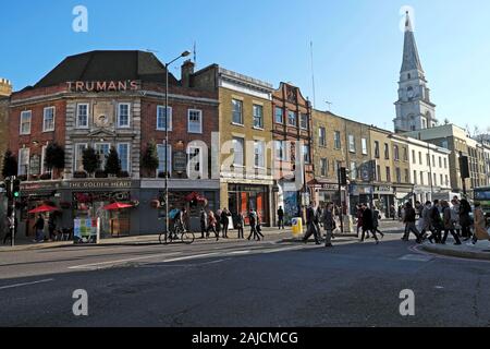 A view of Truman's pub, row terraced housing and Christ Church spire on Commercial Street in Spitalfields East London E1 England UK  KATHY DEWITT Stock Photo