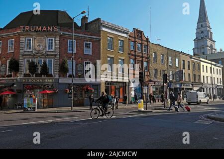 A view of Truman's pub, row terraced housing and Christ Church spire on Commercial Street in Spitalfields East London E1 England UK  KATHY DEWITT Stock Photo