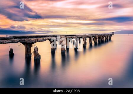 Lahaina Harbor at sunset. West Maui Mountains in the background, with ...