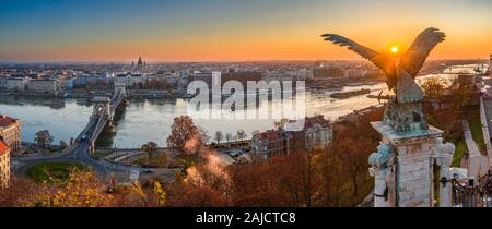 Budapest, Hungary - Aerial panoramic view of Budapest, taken from Buda Castle Royal Palace at autumn sunrise. Szechenyi Chain Bridge, River Danube and
