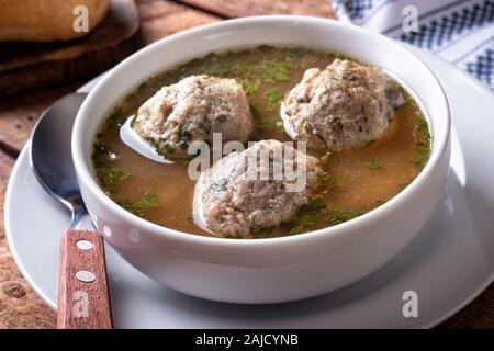 A bowl of delicious homemade liver dumpling soup. Stock Photo