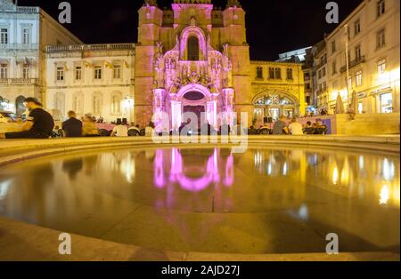 Coimbra, Portugal - Sept 6th 2019: People in Praca Oito de Maio with main facade of Santa Cruz Monastery and Town Hall. Lower Coimbra, the medieval pa Stock Photo