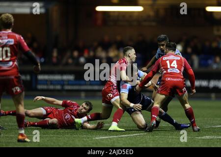 Cardiff, UK. 03rd Jan, 2020. Josh Adams of Cardiff Blues is tackled by Gareth Davies of the Scarlets. Guinness Pro14 rugby match, Cardiff Blues v Scarlets at the BT Sport Cardiff Arms Park in Cardiff on Friday 3rd January 2020. this image may only be used for Editorial purposes. Editorial use only. pic by Andrew Orchard/Andrew Orchard sports photography/Alamy Live news Credit: Andrew Orchard sports photography/Alamy Live News Stock Photo