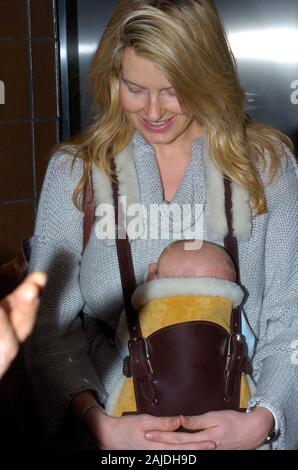 MIAMI,  FL. JANUARY 5 2005: Rocker Rod Stewart and his fiancee, former model Penny Lancaster arrive at Miami International Airport from the UK with their newborn baby, Alastair Wallace Stewart.  January 08, 2006 in Miami, Florida.  People; Rod Stewart; Penny Lancaster; Alastair Wallace Stewart Stock Photo
