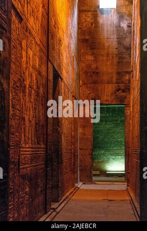 enlightened hieroglyphs Inside the sanctuary at the centre of the egyptian Temple of Horus at Edfu, in Egypt. Stock Photo