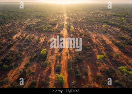 Sunrise on a remote australian desert track. Stock Photo