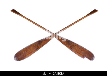 A pair of old, well-used, partially broken oars, isolated on a white background Stock Photo