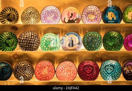 Close-up view of the colorful handicraft bowls selling in the souvenirs stall at Ratchada Rot Fai Train Night Market Bangkok,Thailand. Stock Photo