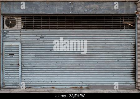vintage store or shop with closed metal shutter Stock Photo