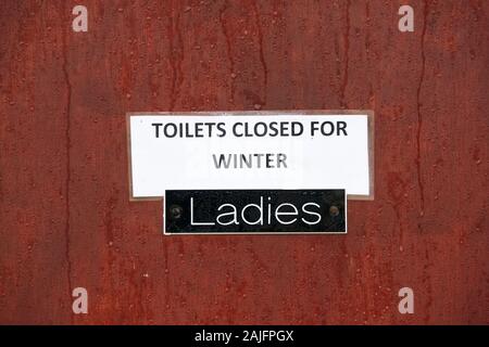 Toilet closed for ladies sign during winter season Stock Photo