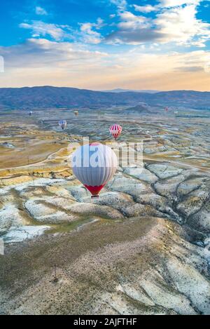 A hot air balloon flying over Cappadocia, Turkey Stock Photo